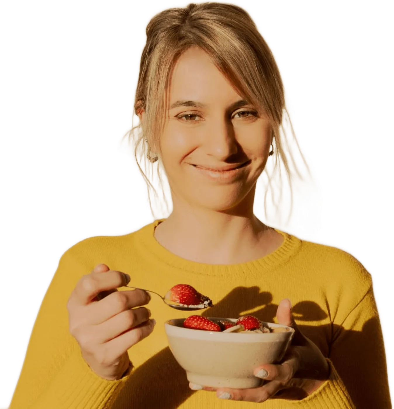 Emi Lavin, Lic. en Nutrición, sonriendo con un bowl de fruta